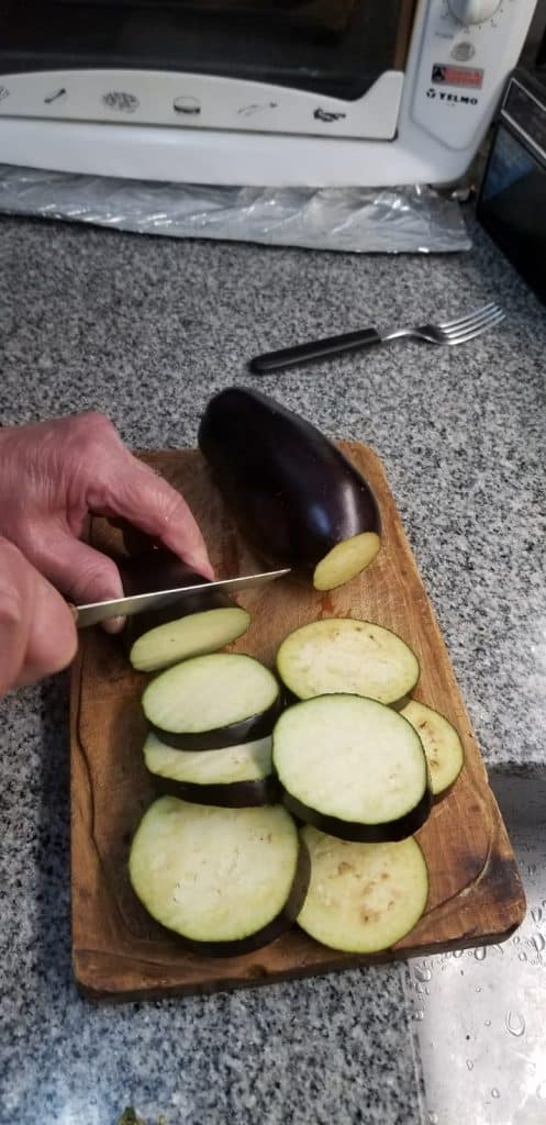 Slicing the eggplants for eggplant escabeche.