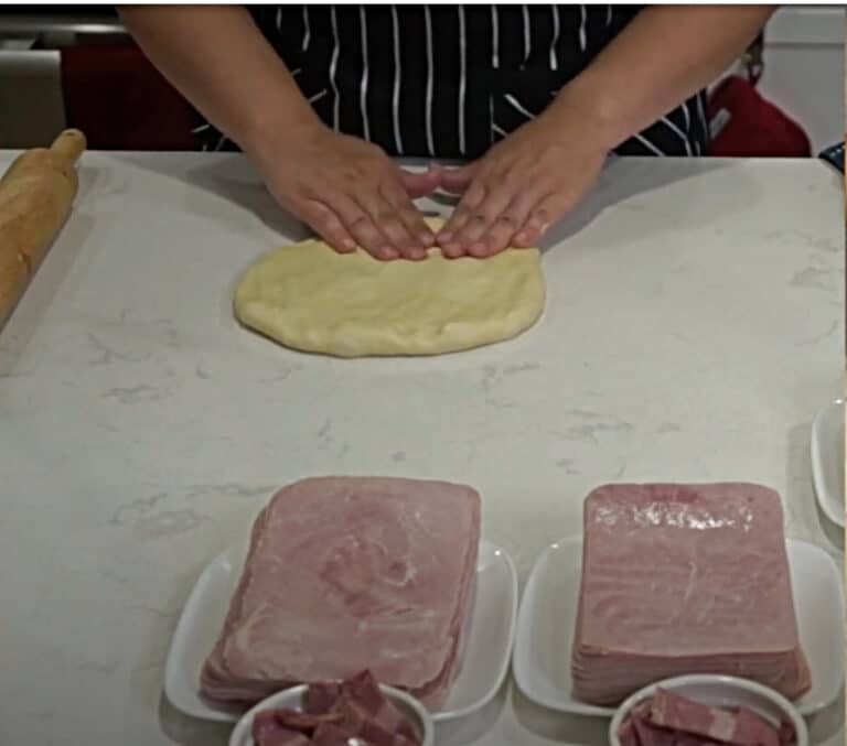 Pan de Jamon work the dough into a flat shape