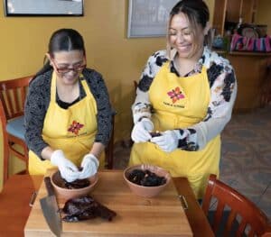 Rosa Camarena and Ale make mole