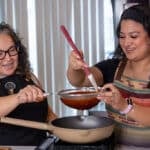Vivi makes the sauce for enchiladas Michoacanas for National Hispanic Month